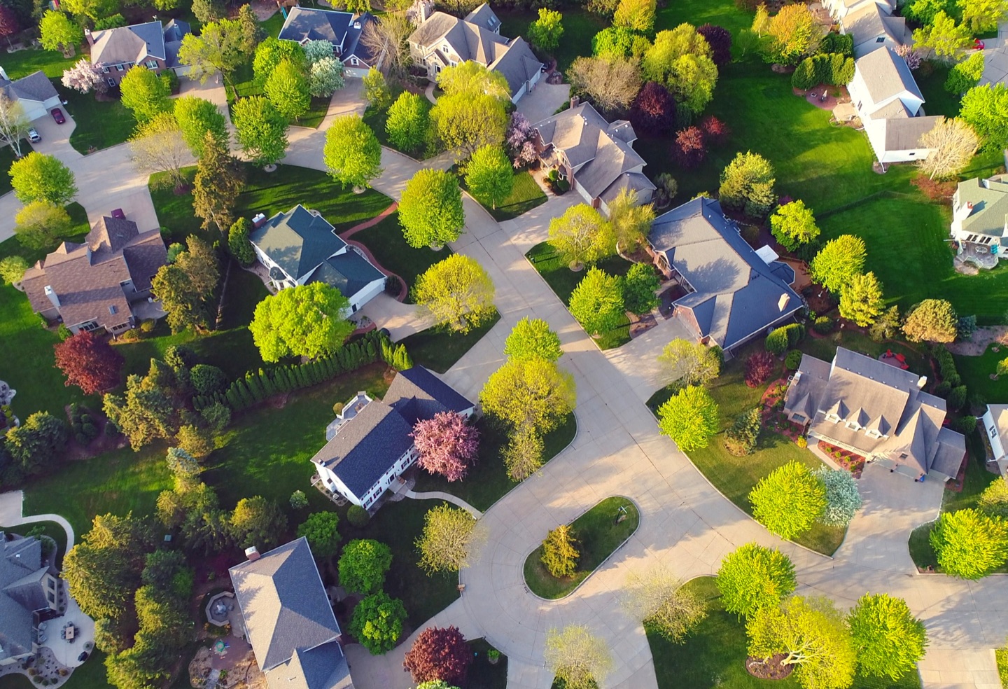 An aerial view of North Texas homes and neighborhoods, representing a growing real estate portfolio.