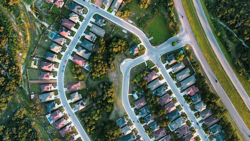 An established, tree-lined luxury residential neighborhood.