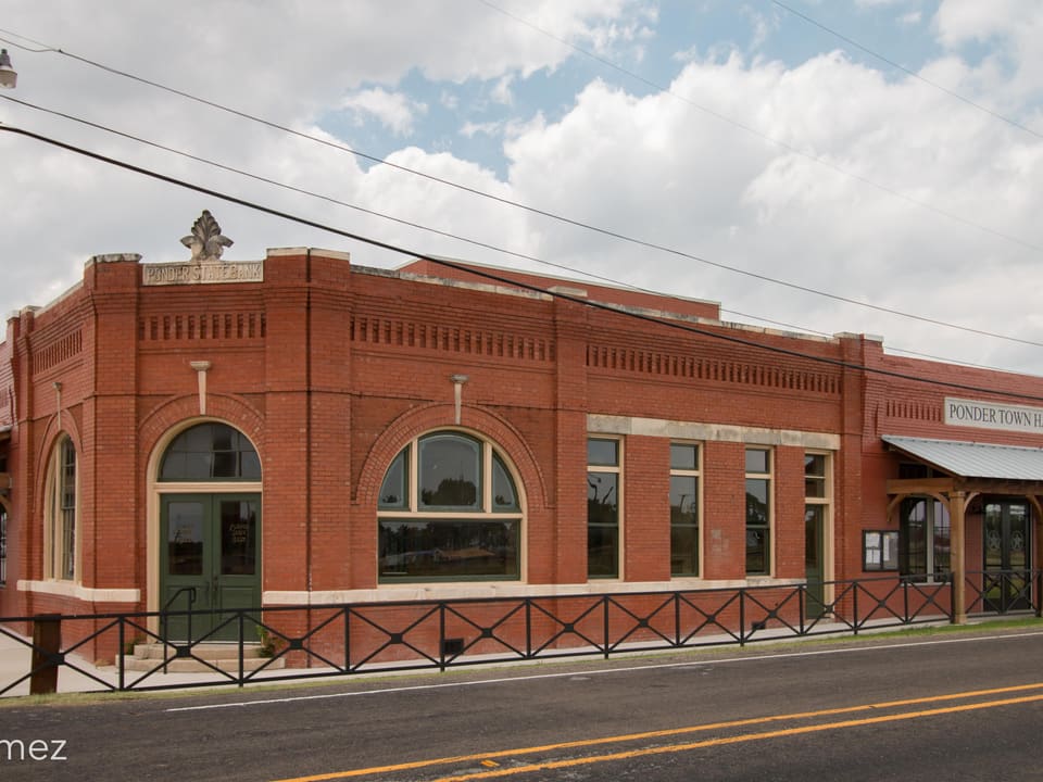The historic red-brick Ponder State Bank building, now Ponder Town Hall, in Ponder, Texas.